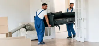 Expert movers carefully handling furniture during residential relocation